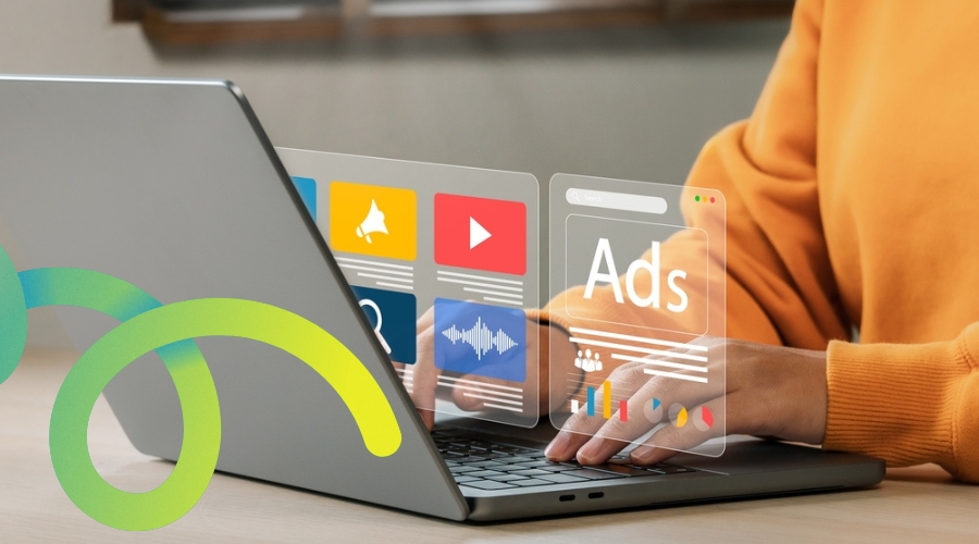 Digital marketing and advertising strategy concept with a user interacting with holographic icons for audio, video, social media, and search ads on a laptop.